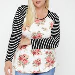Floral Top Featuring Raglan Style Striped Sleeves And A Round Neck