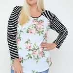 Floral Top Featuring Raglan Style Striped Sleeves And A Round Neck