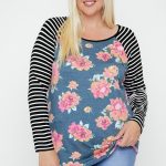Floral Top Featuring Raglan Style Striped Sleeves And A Round Neck
